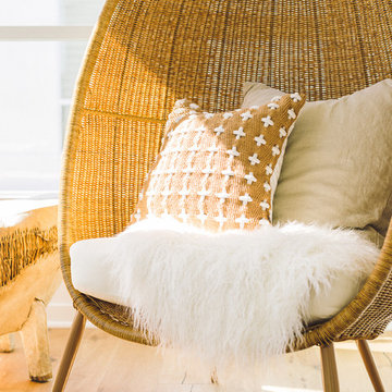 Modern Egg-shaped Wicker Chair with Sheepskin