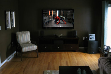 Example of a mid-sized trendy formal and enclosed living room design in Phoenix with a wall-mounted tv