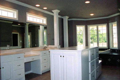 Inspiration for a large master beige tile and ceramic tile bathroom remodel in Austin with recessed-panel cabinets, white cabinets and granite countertops