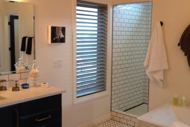 Bathroom - large contemporary master black and white tile and subway tile ceramic tile bathroom idea in Calgary with flat-panel cabinets, black cabinets, white walls, an undermount sink and granite countertops