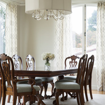 Elegant Traditional Dining Room with Carved Walnut Chairs and Crystal Chandelier