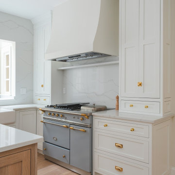 Château Charm: French-Inspired Kitchen Renovation with Plaster Hood Blue Stove a