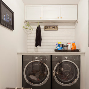 Small single-wall separated utility room in New York with shaker cabinets, white cabinets, white walls, porcelain flooring, a side by side washer and dryer and granite worktops.