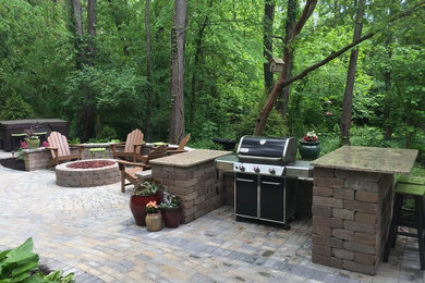 Inspiration for a large timeless backyard concrete paver patio remodel in Indianapolis with a fire pit
