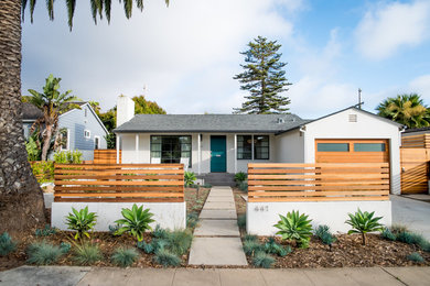 Inspiration for a mid-century modern white one-story stucco exterior home remodel in San Diego with a shingle roof