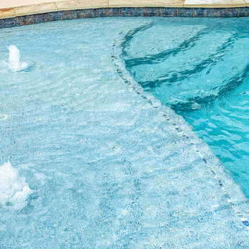 Freeform Pool, beach entry and rock waterfall
