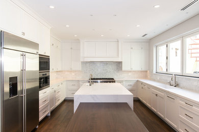 Enclosed kitchen - large contemporary u-shaped dark wood floor enclosed kitchen idea in Chicago with an undermount sink, shaker cabinets, white cabinets, quartzite countertops, gray backsplash, subway tile backsplash, an island and stainless steel appliances