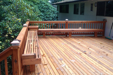 Inspiration for a mid-sized backyard deck remodel in Seattle with no cover