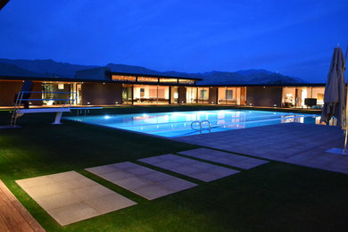 Example of a large trendy backyard rectangular lap pool design in Los Angeles
