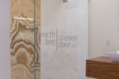 Minimalist master white tile and stone slab marble floor doorless shower photo in San Francisco with wood countertops and beige walls