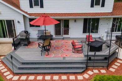 Mid-sized transitional backyard metal railing deck photo with a bbq area