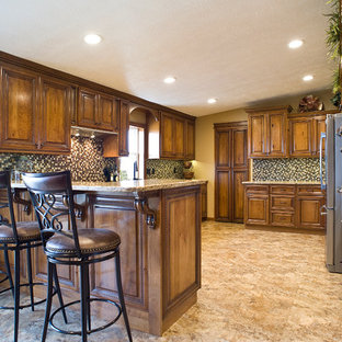 Mid-sized traditional kitchen pantry designs - Kitchen pantry - mid-sized traditional u-shaped kitchen pantry idea in Indianapolis with an undermount sink, raised-panel cabinets, medium tone wood cabinets, granite countertops, brown backsplash, glass tile backsplash, stainless steel appliances and no island