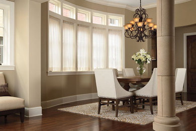 Mid-sized elegant dark wood floor and brown floor great room photo in Other with beige walls and no fireplace
