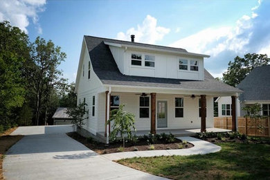 Example of a farmhouse exterior home design in Nashville