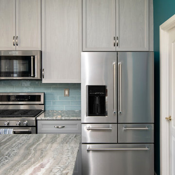 Gray Transitional Kitchen Cabinets with Complementary Gray Granite Countertops