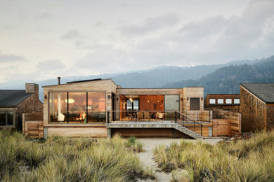 Inspiration for a coastal brown wood house exterior remodel in San Francisco with a black roof