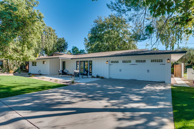 Inspiration for a mid-sized country white one-story house exterior remodel in Phoenix