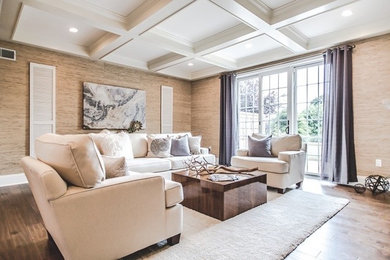 Example of a transitional medium tone wood floor living room design in New York