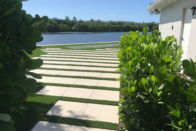 Design ideas for a modern full sun backyard outdoor basketball/tennis/multi-game court in Miami.