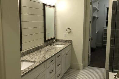 Example of a transitional bathroom design in Other