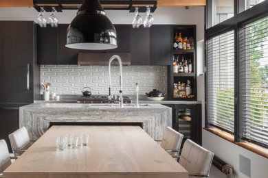 Inspiration for a modern kitchen remodel in Seattle with flat-panel cabinets, black cabinets, gray backsplash and an island