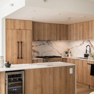 Sleek Modern Kitchen with Wood Grain Cabinetry & Waterfall Island