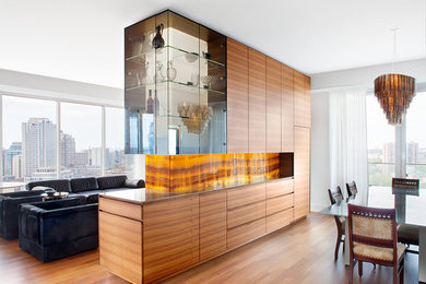 This is an example of a large contemporary open plan dining in Toronto with white walls and medium hardwood floors.