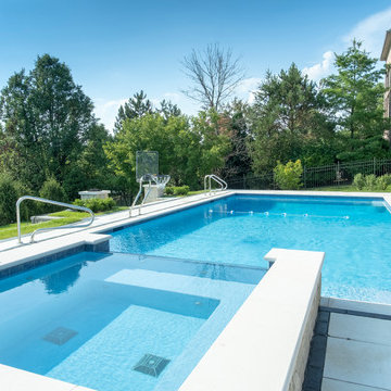 Burr Ridge Lap Pool with Raised Hot Tub and Waterfall