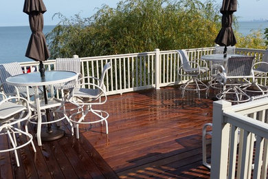 Example of a large classic backyard deck design in Cleveland with no cover