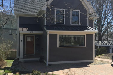 Example of an arts and crafts exterior home design in Boston