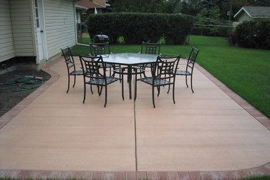 Mid-sized traditional backyard patio in Minneapolis with stamped concrete and no cover.