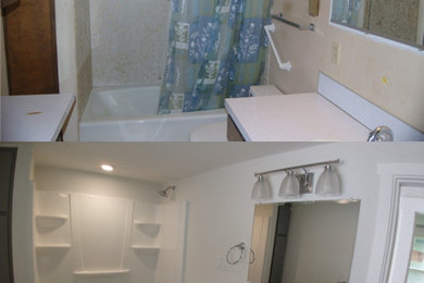 Mid-sized arts and crafts master multicolored tile and glass sheet vinyl floor and gray floor bathroom photo in Portland with recessed-panel cabinets, blue cabinets, a two-piece toilet, white walls, an undermount sink, quartzite countertops, white countertops and a floating vanity