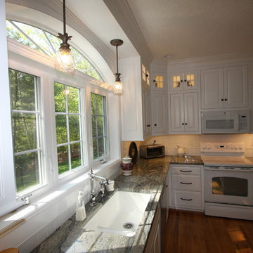Custom White Kitchen with Scottish Meadow Granite tops