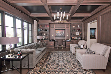 Huge elegant built-in desk dark wood floor and brown floor study room photo in Chicago