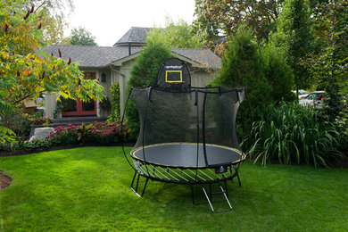 This is an example of a contemporary garden in Seattle with with outdoor playset.