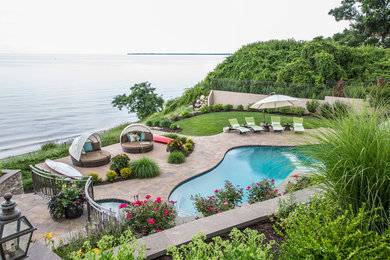Inspiration for a transitional pool remodel in New York