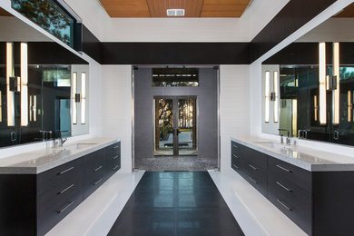 Inspiration for a large modern master porcelain tile and multicolored floor bathroom remodel in Orlando with flat-panel cabinets, black cabinets, white walls, an undermount sink, terrazzo countertops and white countertops