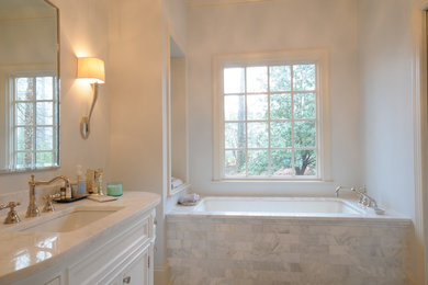 Large elegant master gray tile, white tile and stone tile marble floor and multicolored floor bathroom photo in Birmingham with beaded inset cabinets, white cabinets, a two-piece toilet, beige walls, an undermount sink and marble countertops