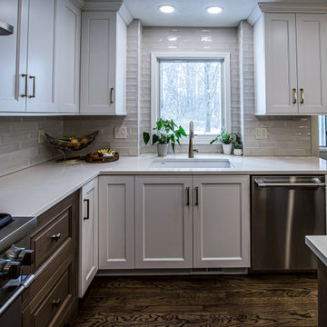 Two Tone Kitchen with Floating Shelves and Island Seating and Updated Fireplace
