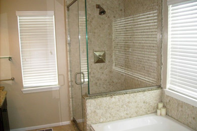 Mid-sized mountain style ceramic tile alcove shower photo in Chicago with black cabinets, beige walls, an undermount sink and granite countertops