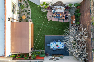Inspiration for a southwestern drought-tolerant backyard stone landscaping in Los Angeles.