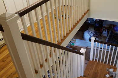 Staircase - large traditional wooden l-shaped wood railing staircase idea in New York with wooden risers