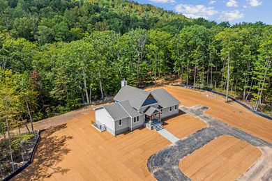 Country gray one-story concrete fiberboard and clapboard exterior home idea in DC Metro with a shingle roof and a gray roof