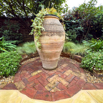Italian courtyard garden with a Large Olive jar