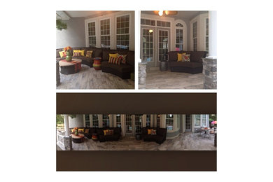 This is an example of a large contemporary tile back porch design in Richmond.