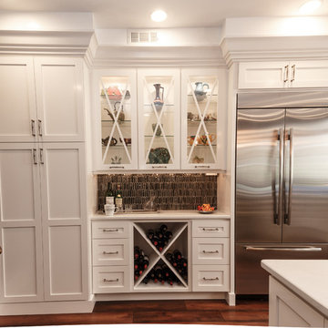 Transitional White Kitchen Remodel | Glass Display Cabinets & Custom Island