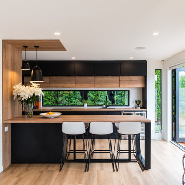 Stunning Black and Wood-Look entertainers kitchen