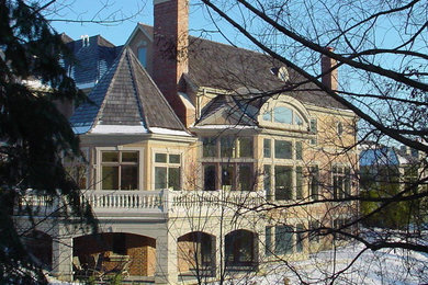 Inspiration for a huge transitional three-story brick exterior home remodel in Chicago