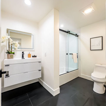 Guest Bath with Floating White Vanity and Slate Floor