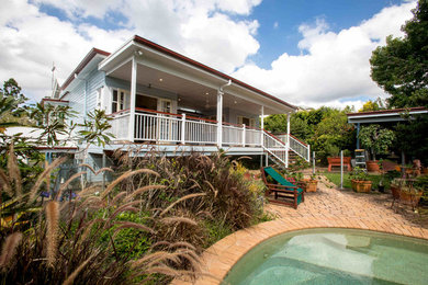 Photo of a large traditional home design in Brisbane.